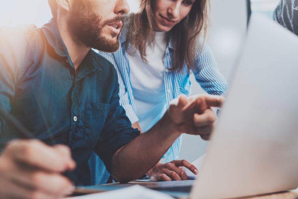 Two People Looking Over Online Job Postings