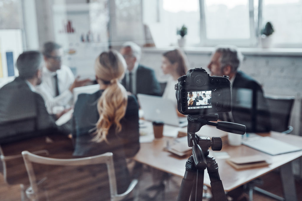 Camera Shot Of Workplace Team Meeting