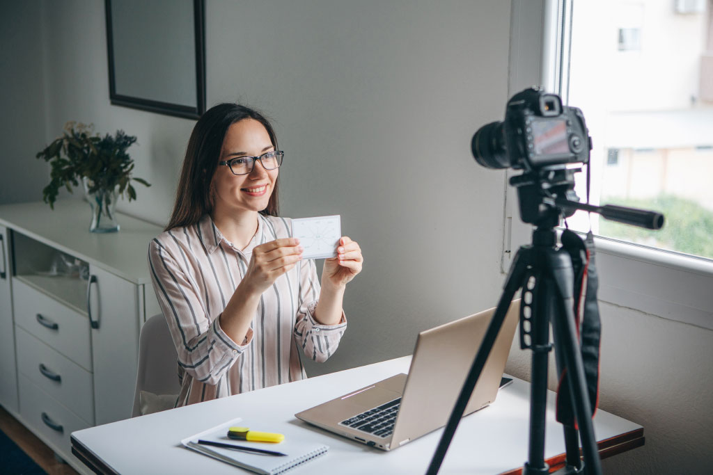 Woman Making Recruitment Video In Front Of Camera