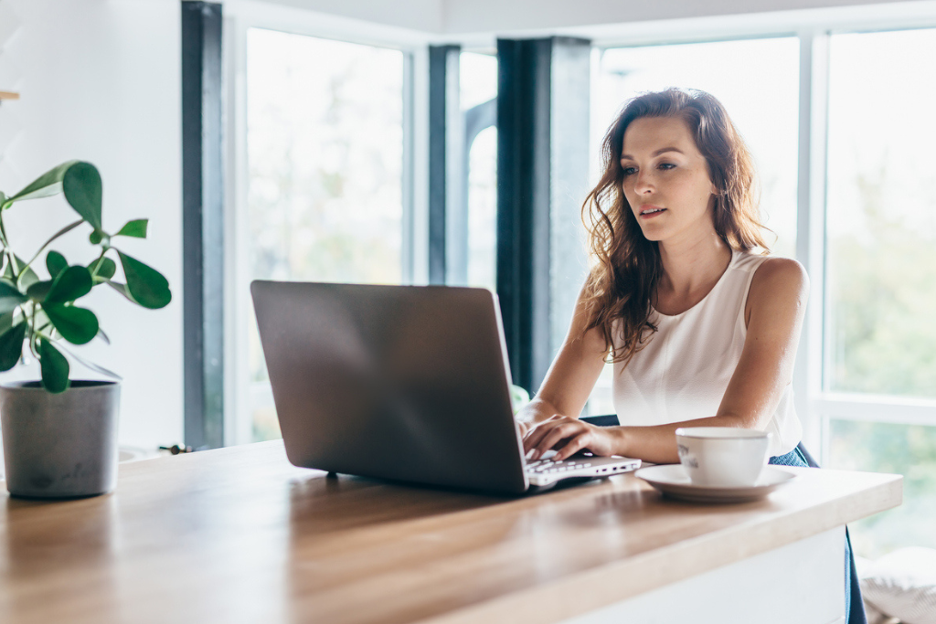 Woman typing on a laptop using TA technology.